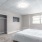 a bedroom with a bed and a television