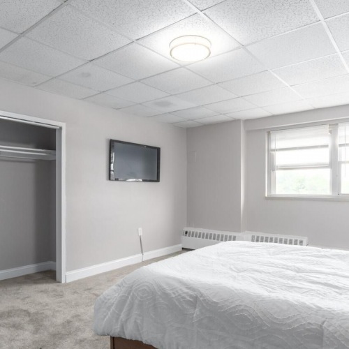 Bedroom options to fit every lifestyle a bedroom with a bed and a television