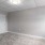 a room with white walls and a light on the ceiling