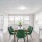 a dining room with green chairs