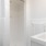 a bathroom with a sink and a shower unit