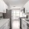 a kitchen with white cabinets
